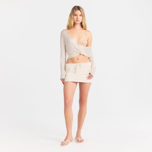 SLINKY KNIT DEEP PLUNGE TOP | BUFF ON A MODEL FRONT VIEW @ | FOCUS: 0.0, 1.0, 0.9